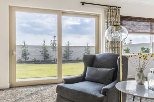 Sliding window door from living room to backyard.