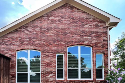 Red brick home with windows